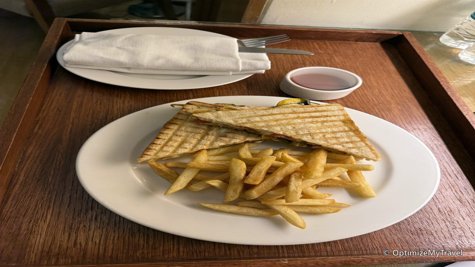 Toasted sandwich and french fries served through hotel room service