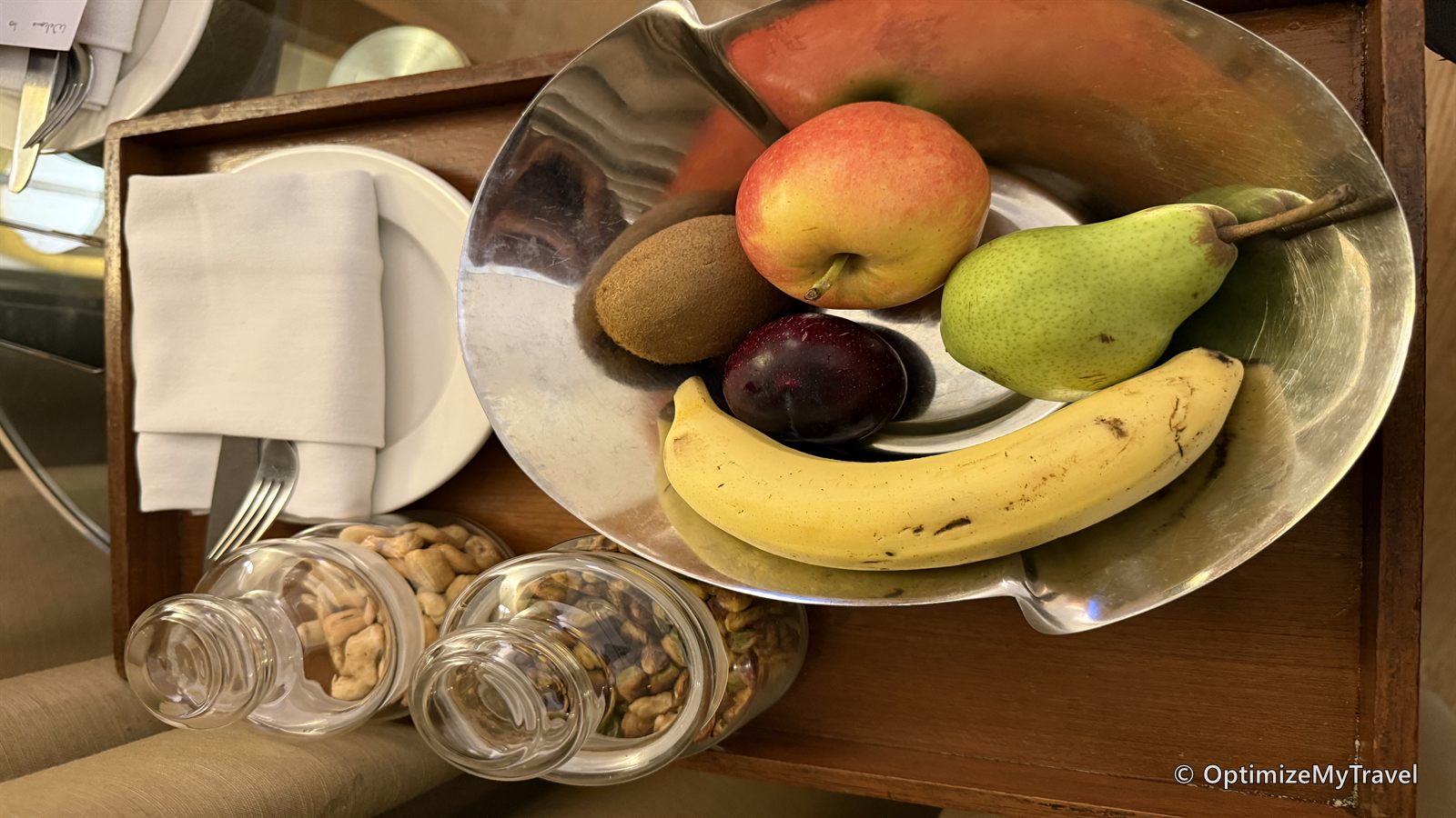 Replacement tray containing fresh fruit and glass jars of nuts