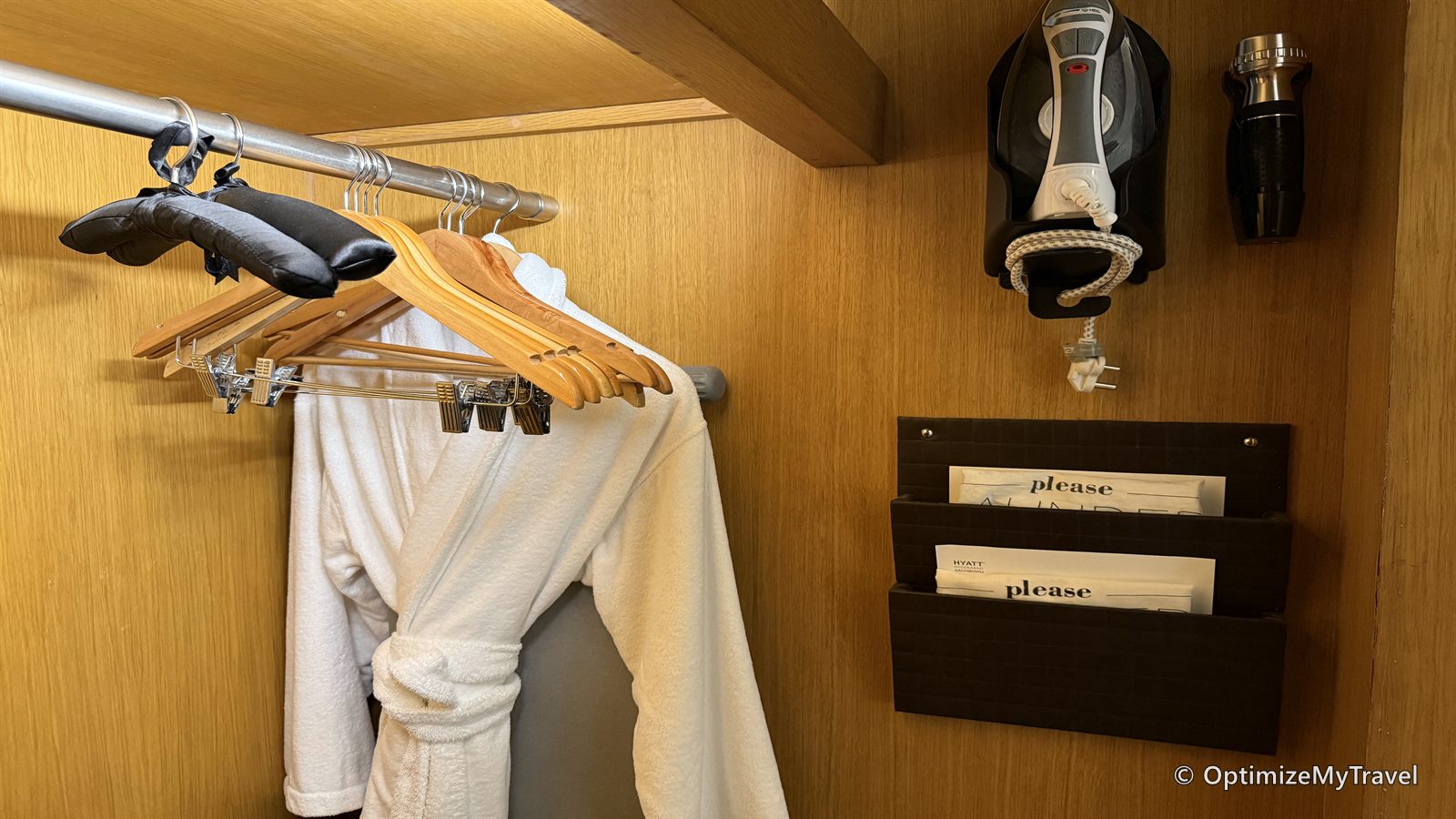 Bathrobes, hangers, flashlight, and shoe-care supplies inside the room wardrobe